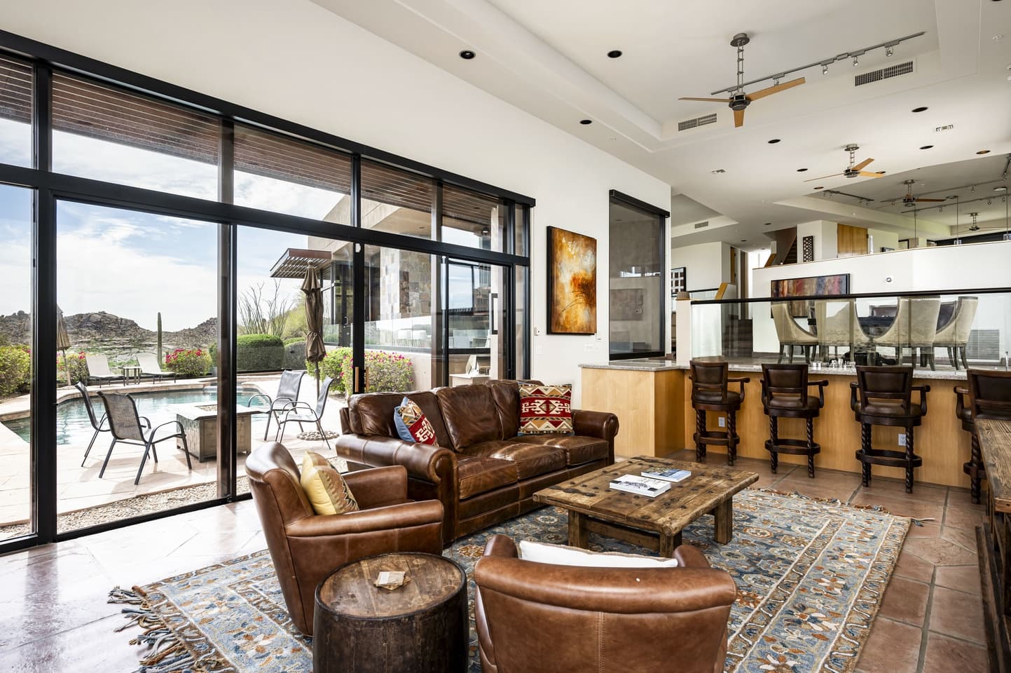 The Lower Great Room opening to the pool patio