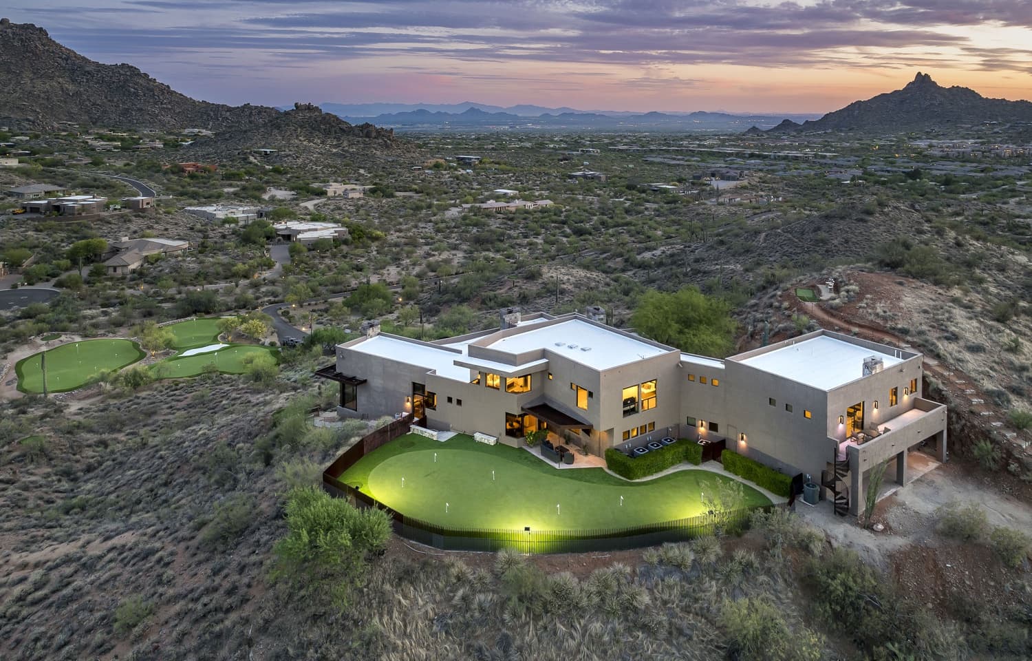 The backyard putting green lighted for night putting
